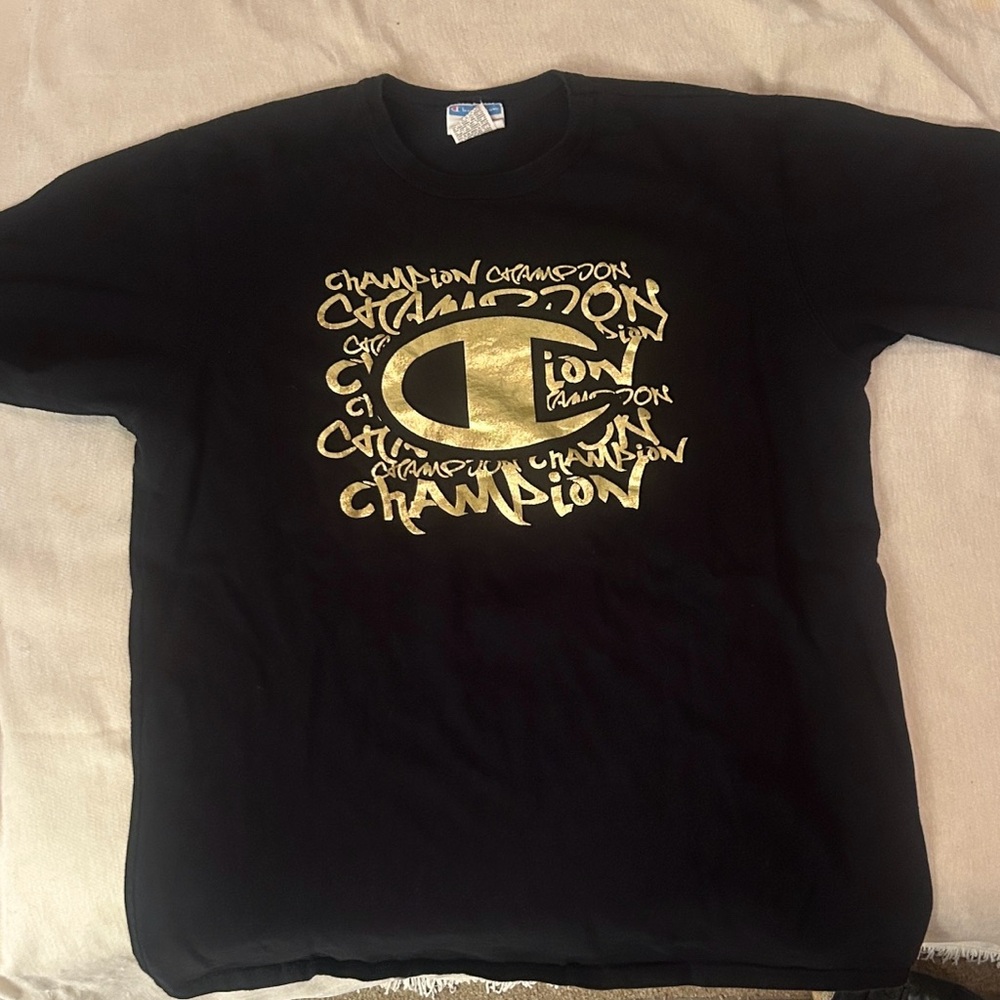 Champion' Black Tee with Gold Logo